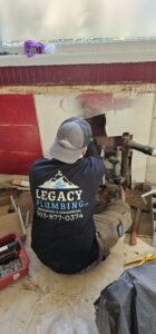 A plumber wearing a 