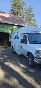 A white utility van with 