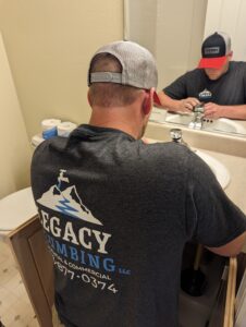 A plumber wearing a 